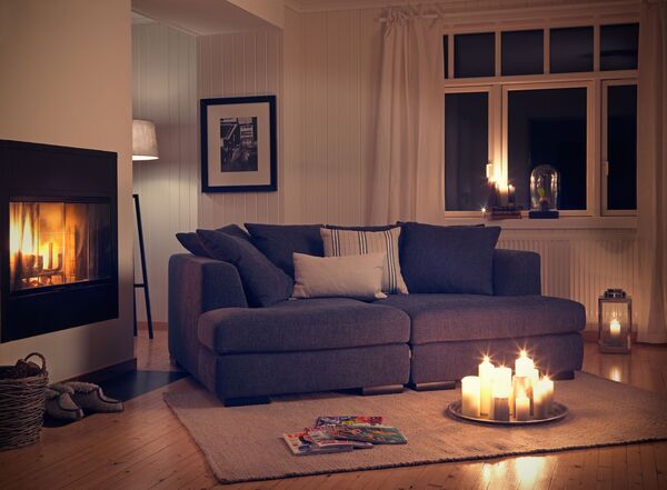 Cozy living room with dim lighting and a sofa